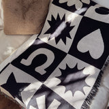 Folk Shapes Patchwork Throw Blanket on Couch