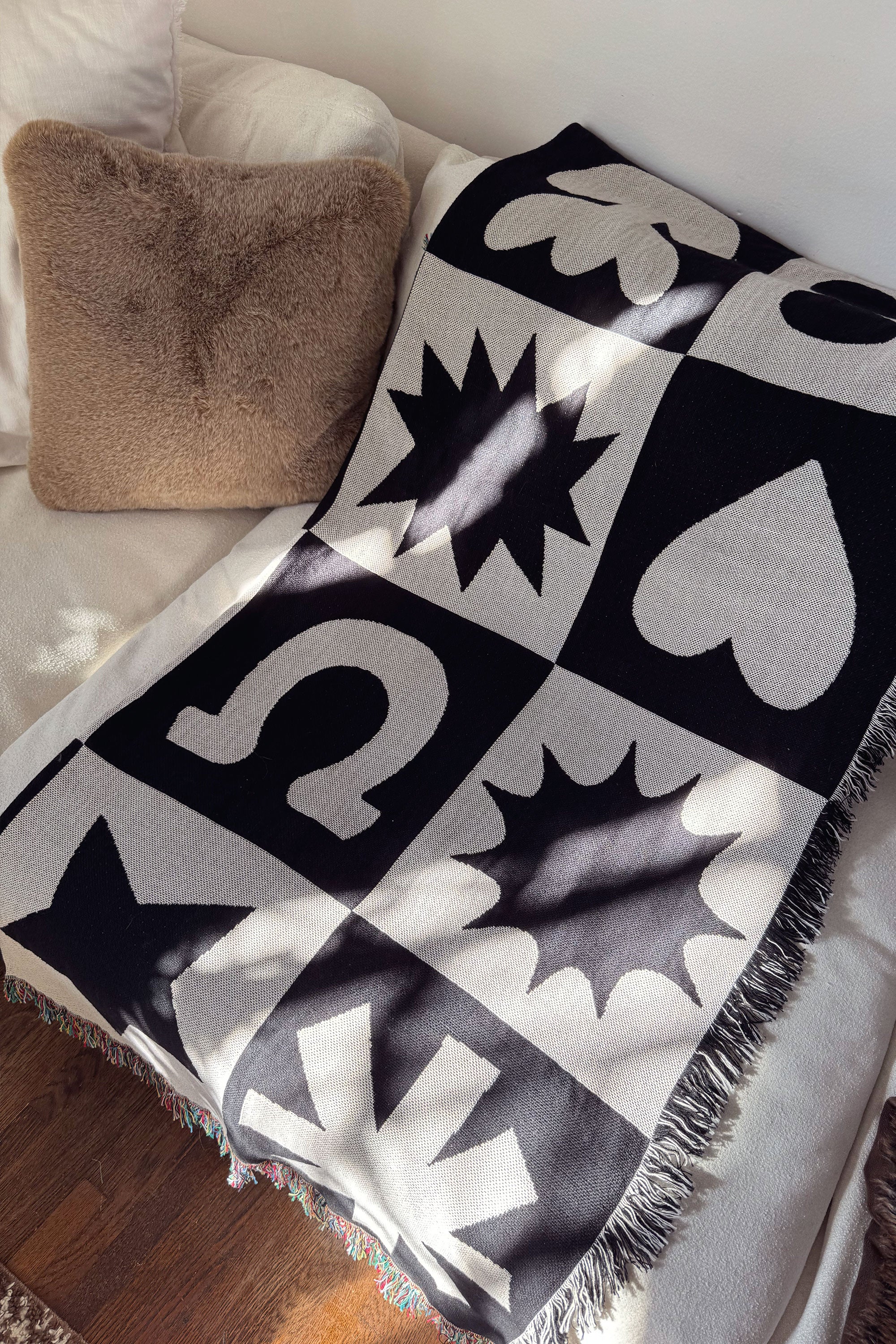 Folk Shapes Patchwork Throw Blanket on Couch