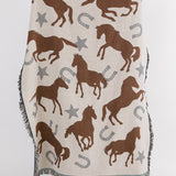 Blanket with horse and horseshoe pattern on a white background