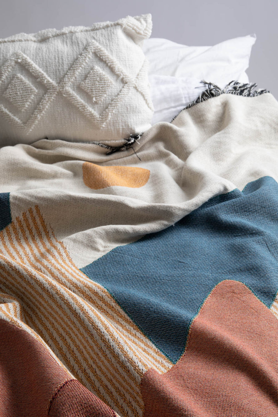 Boho Mountain Throw Blanket On Bed